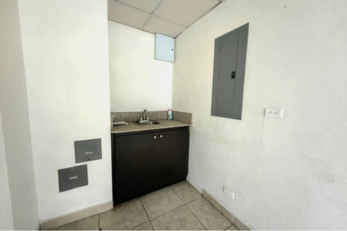 Small kitchenette utility space with granite counters and cabinet in PH Camino de Cruces El Dorado