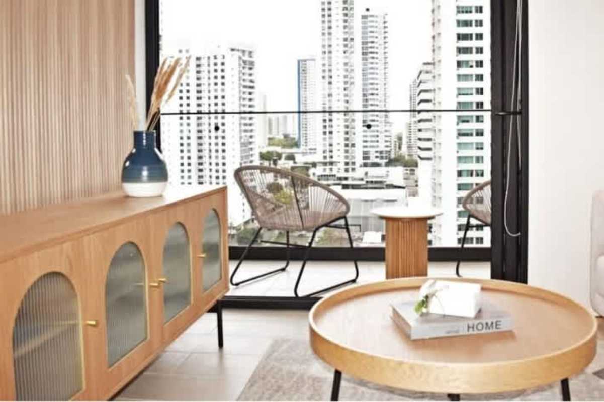 Smart condo living room with balcony and skyline view, PH BeLiving Panama