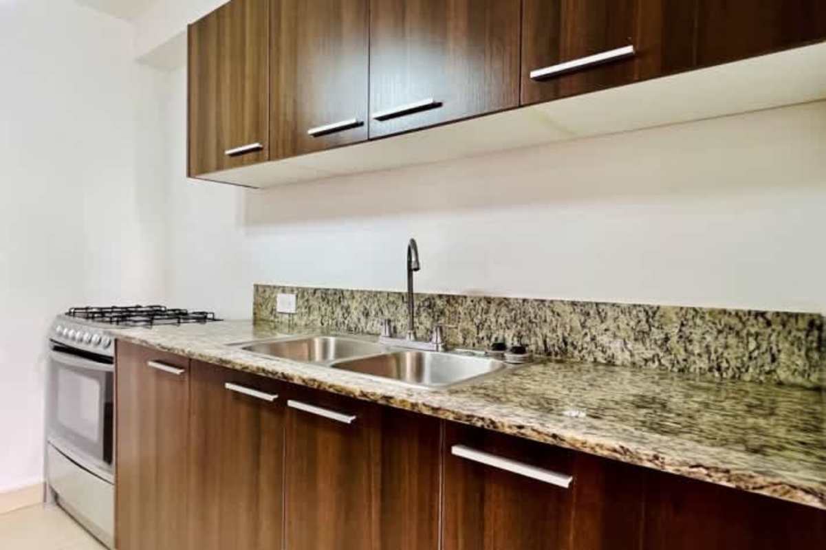 Bathroom with glass shower enclosure and granite vanity PH Spotlight Betania Panama City