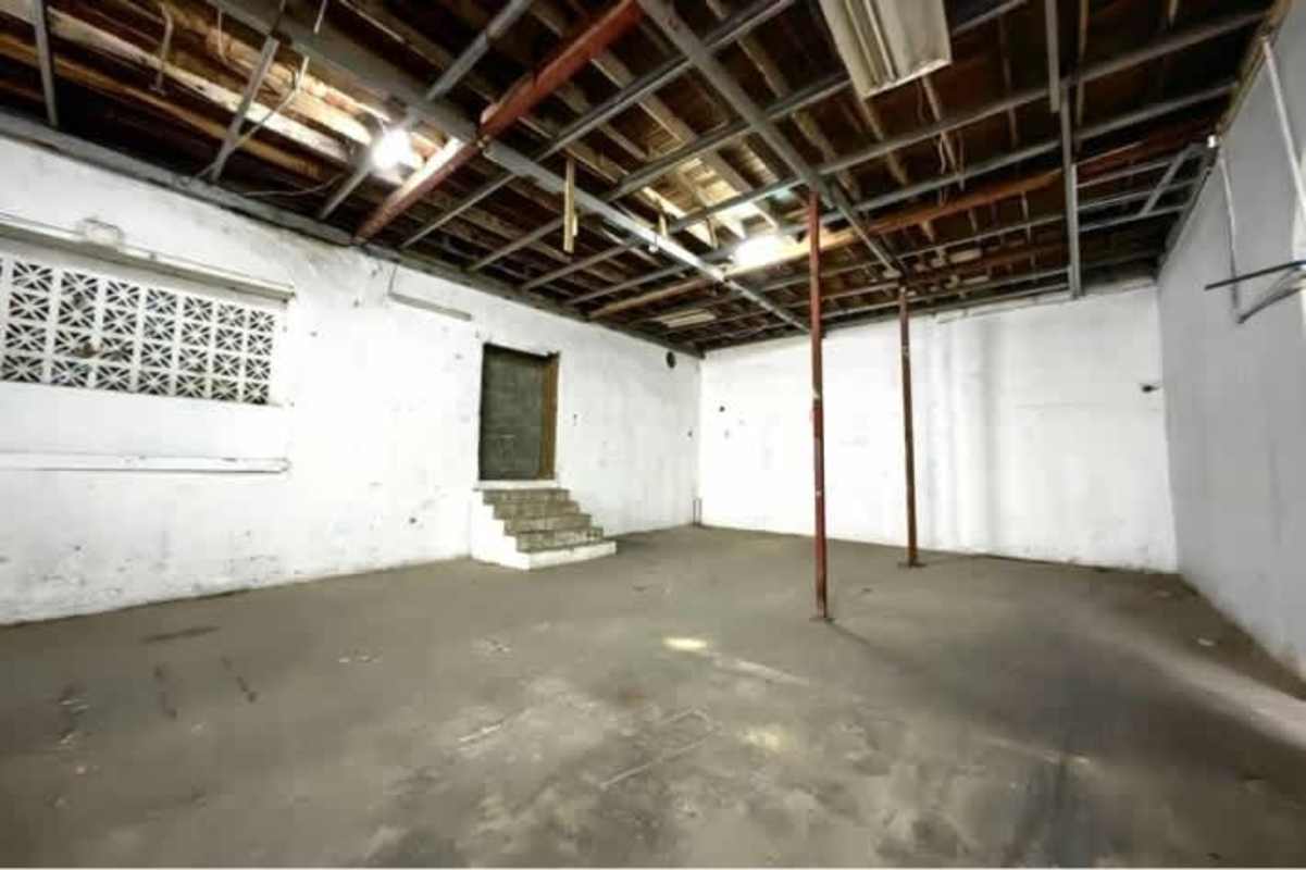 Unfinished interior with exposed stone walls in colonial building Casco Viejo Panama