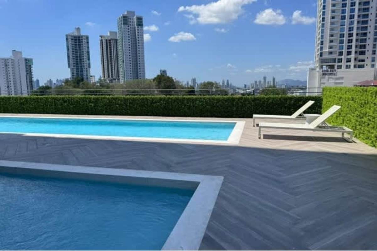 Fully equipped gym overlooking Panama skyline at PH Center Point Tower 12 de Octubre