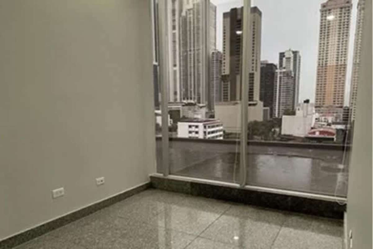 Empty office room with floor-to-ceiling windows skyline view Calle 50 PH BICSA Tower