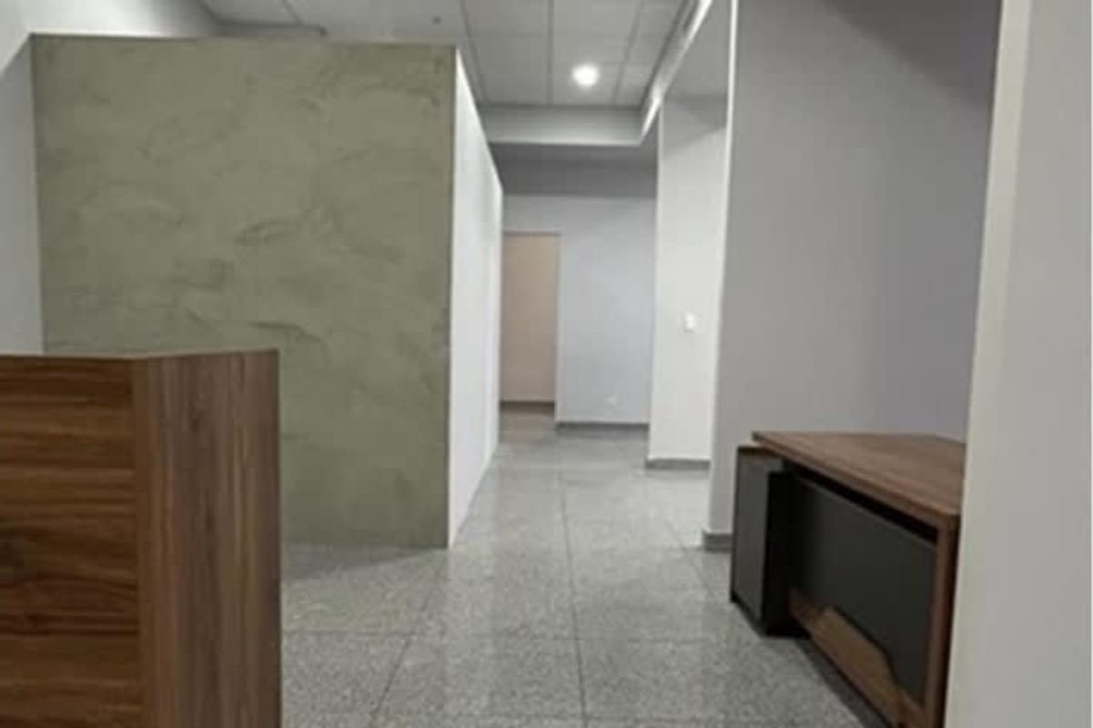 Modern office with partition walls reception desk granite floor PH BICSA Tower