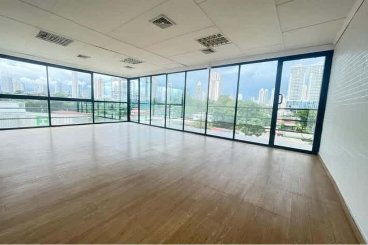Empty open office floor with floor-to-ceiling windows skyline view Panama PH BICSA Tower