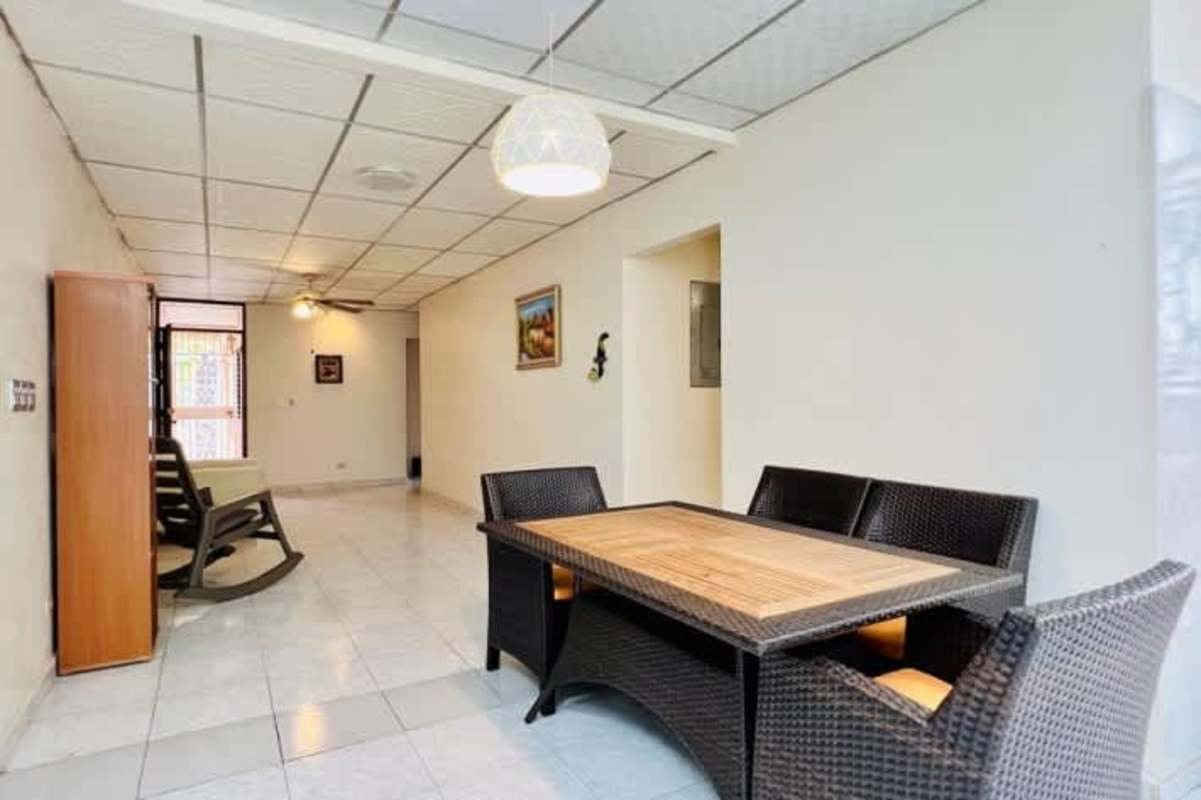 Spacious bedroom with natural light and ceramic floor in Panama gated community home