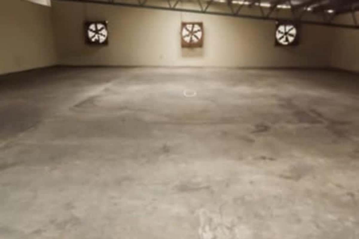 Empty warehouse with skylights, concrete floor and exposed steel beams, Vista Hermosa Panama