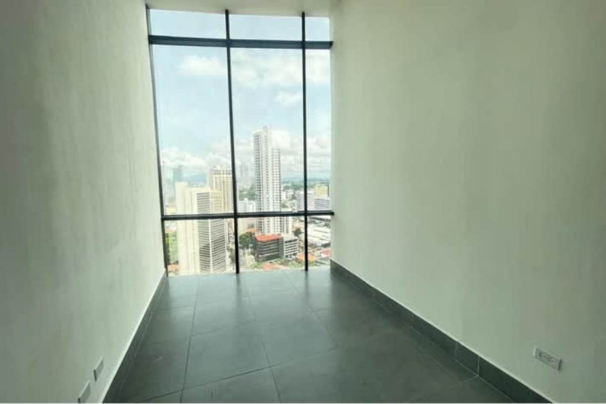Modern commercial space with floor-to-ceiling windows overlooking Panama financial district in PH BICSA Tower