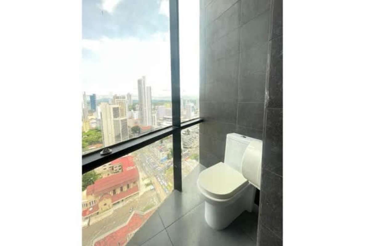 Modern bathroom with tiled walls and vanity in PH BICSA Financial Tower office Panama City