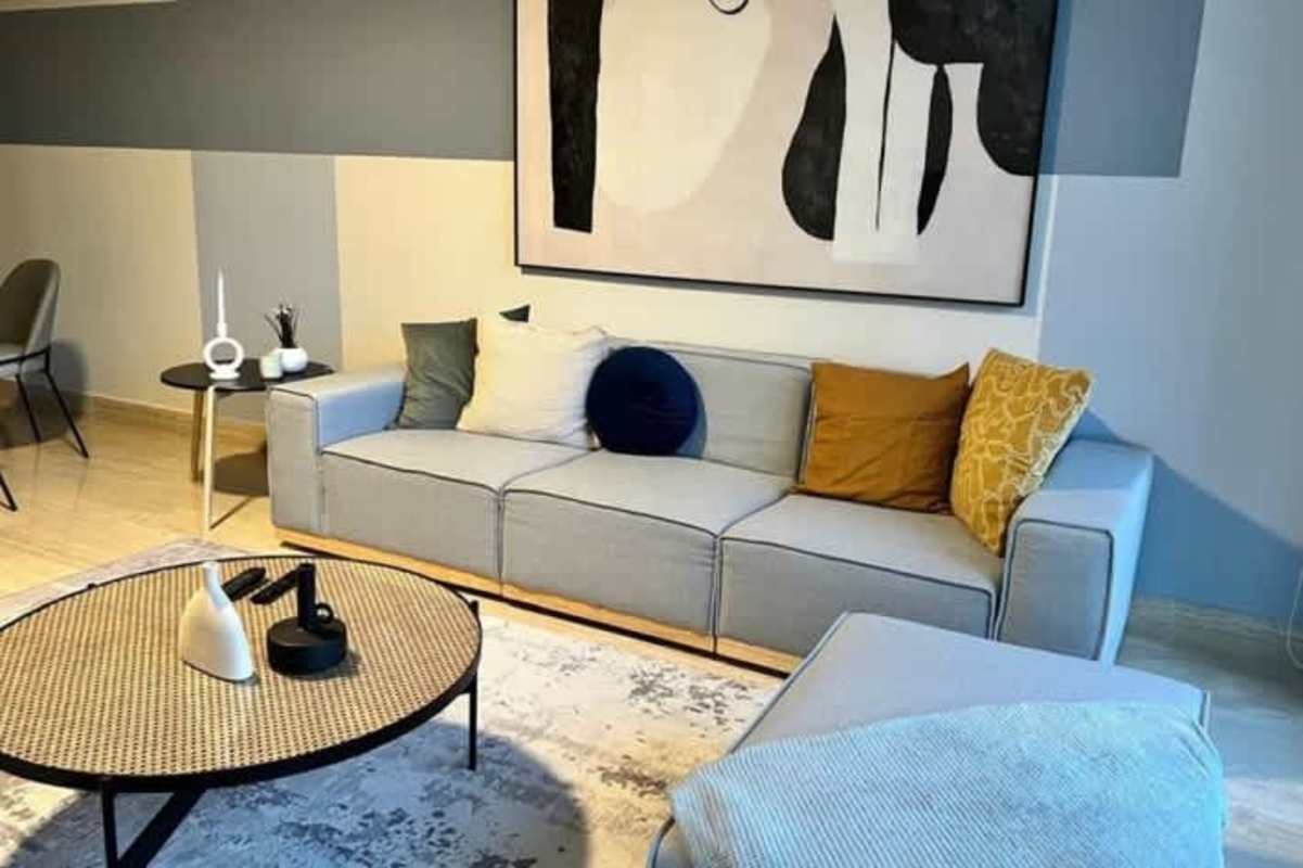 Living and dining area with windows Costa del Este Panama apartment at The Regent