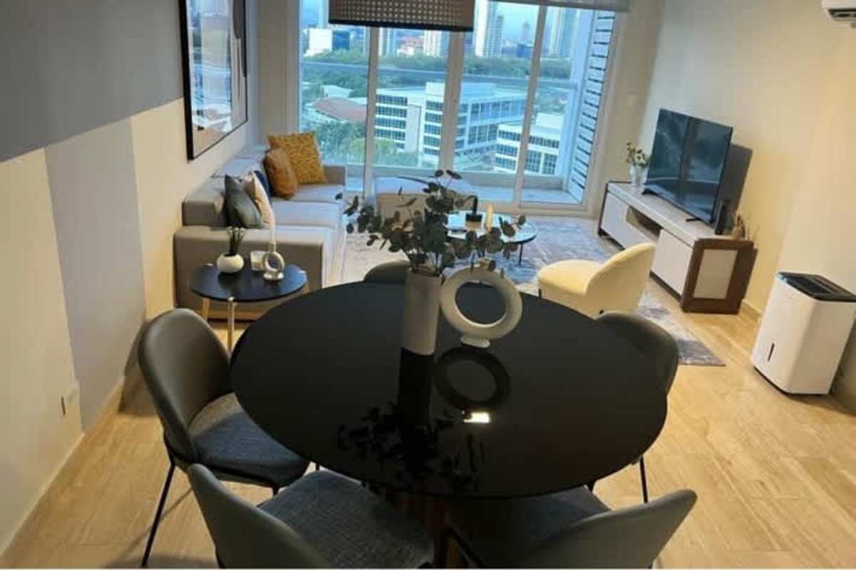 Modern apartment living room with large windows city view in The Regent Costa del Este Panama
