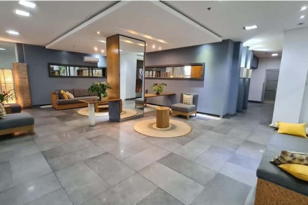 Lobby lounge with sofas, plants and stylish decor at PH Clayton Park 1 in Clayton