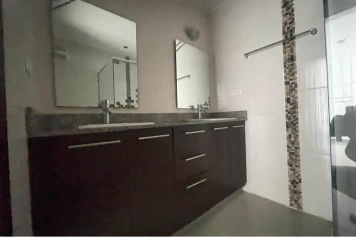 Modern bathroom double vanity granite countertop mosaic accent PH Villa de Las Fuentes Panama
