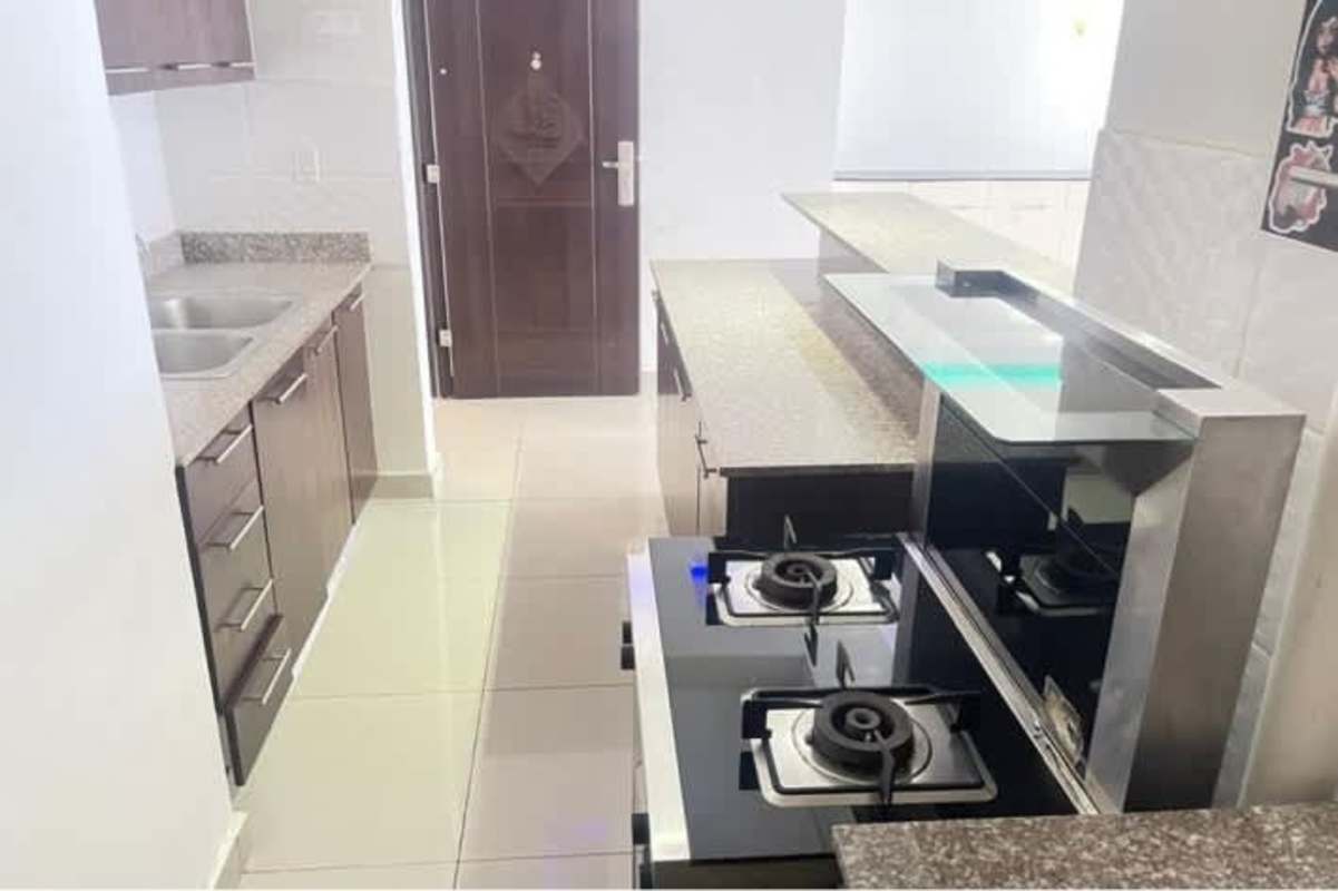 Kitchen with granite counters, gas stove, double sink in PH Villa de Las Fuentes Panama