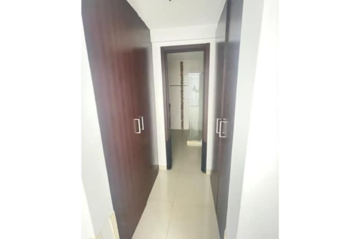 Master suite walk-in closet leading to bathroom with shower in PH Villa de Las Fuentes Panama