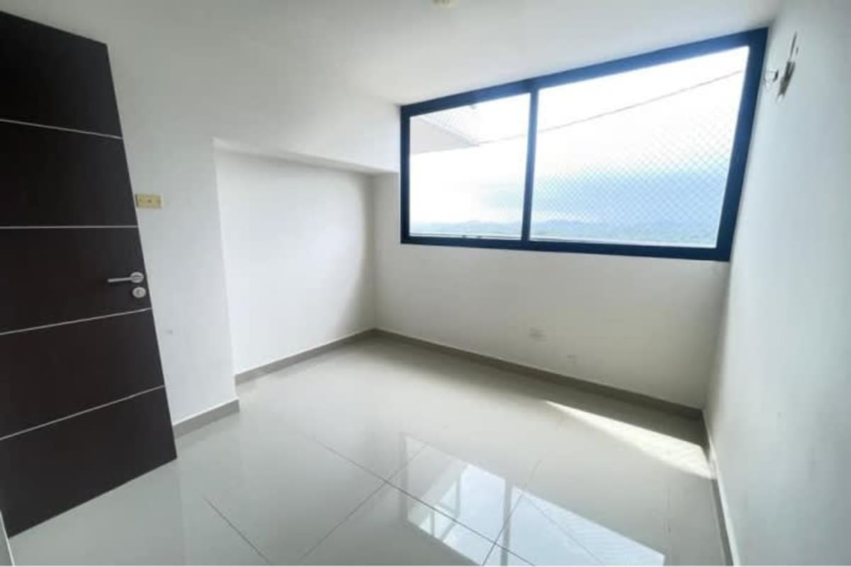 Contemporary living room with marble wall accent, durable tile flooring Betania Panama