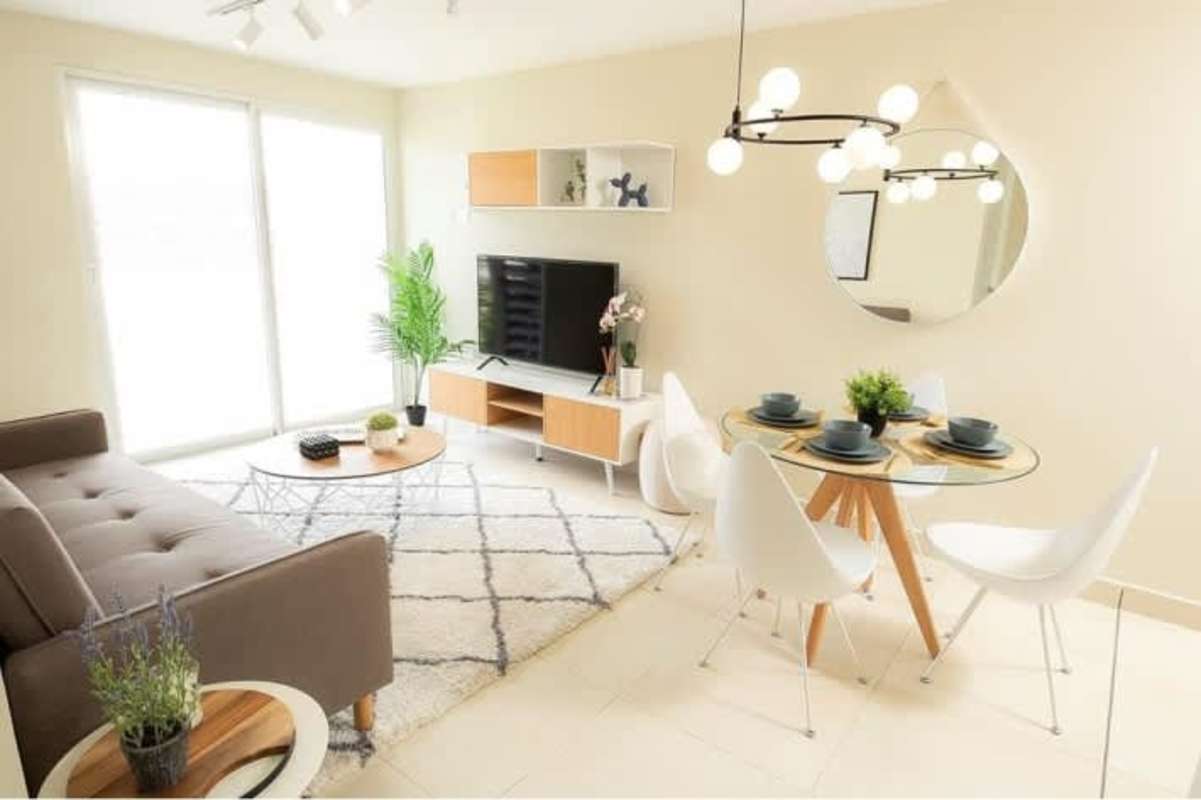 Compact kitchen with granite countertop stainless appliances at PH Panama Viejo Residences Panama