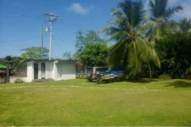 Caribbean style bohío hut and garden at hostel for sale Portobelo Colon Panama coast