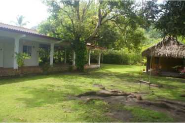 Shady terrace with hammocks in Caribbean hostel on tourist route Portobelo Panama