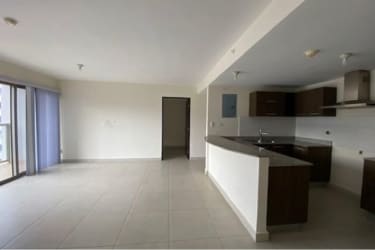 Covered balcony overlooking landscaped community in PH Midrise Woodlands Panama Pacifico apartment