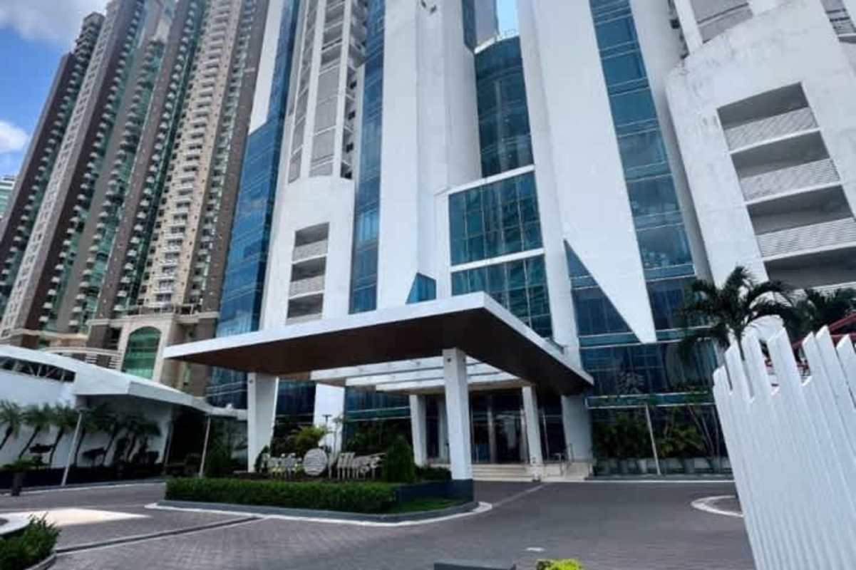 Spacious living area with double height windows and balcony at PH Pacific Village Punta Pacifica