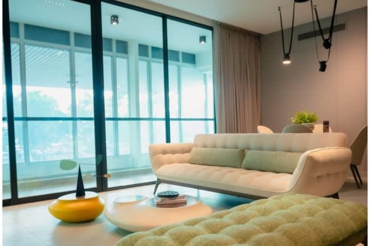 Modern living room with floor-to-ceiling windows, skyline balcony, at Uptown Condo Suites Panama