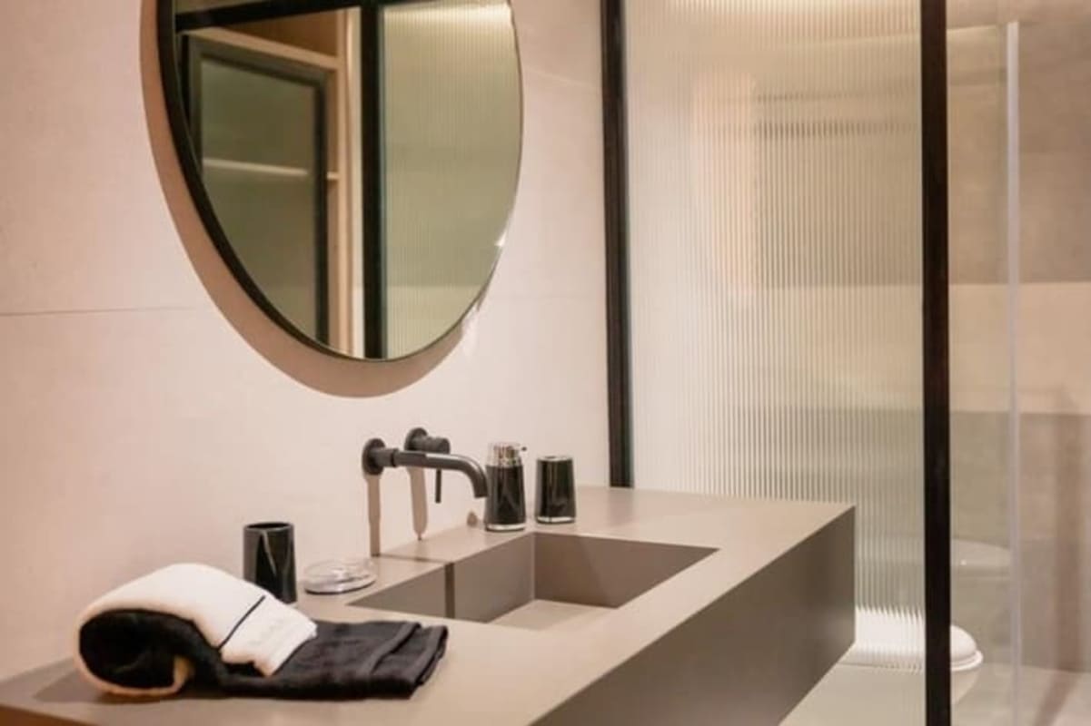 Modern bathroom with glass shower at Uptown Condo-Suites Panama Airbnb apartment