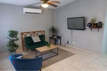 Covered front terrace with tiled floor next to carport Verde Real La Chorrera Panama