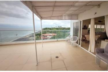 Modern open kitchen with large island, stainless appliances and ocean view windows in Farallon Tower Panama