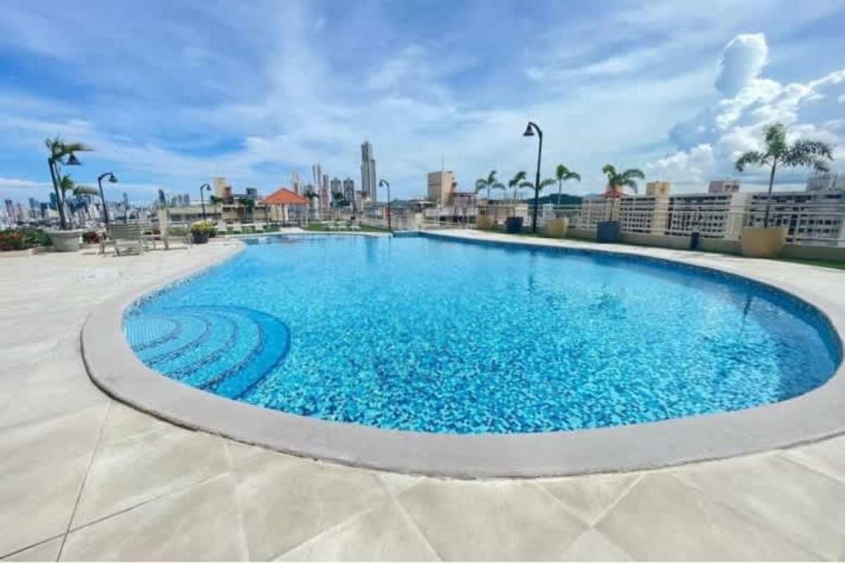 Circular rooftop pool area overlooking Panama skyline Betania Panama