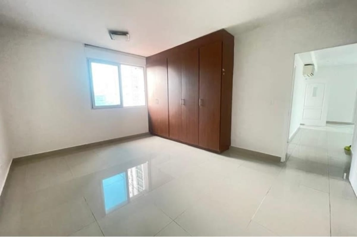 Minimalist bathroom with glass shower enclosure pedestal sink tiled floor in PH El Cangrejo
