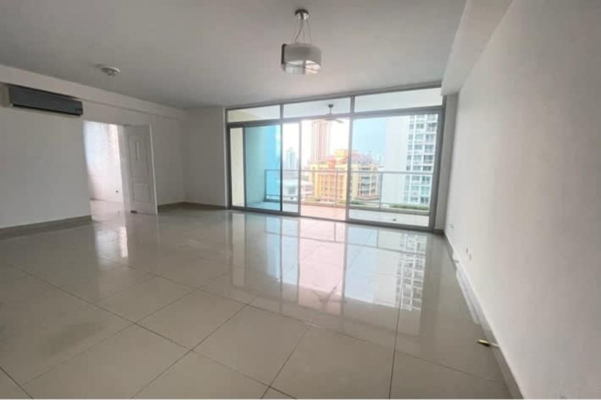 Spacious living room with sliding glass doors onto balcony in PH El Cangrejo Bella Vista Panama