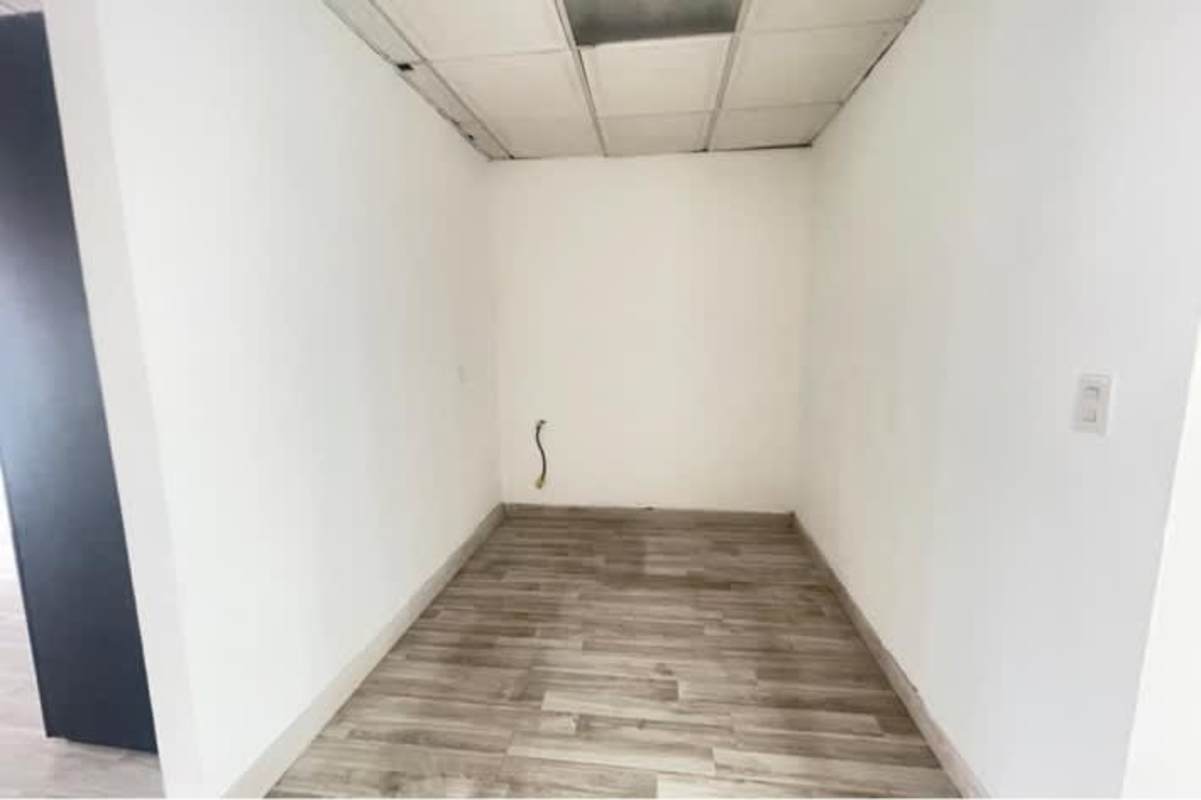 Open empty commercial office space with city views and column inside PH BICSA Financial Center Panama