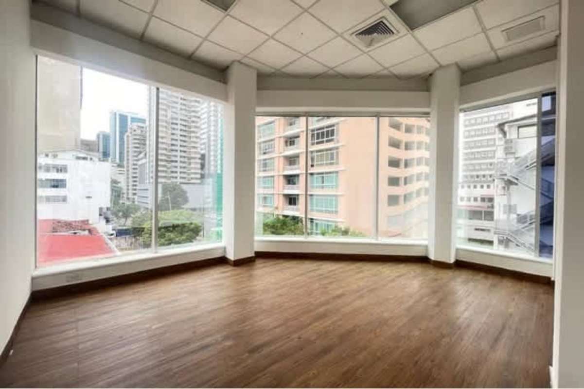 Spacious open plan workspace with city and skyline views at PH BICSA Panama City