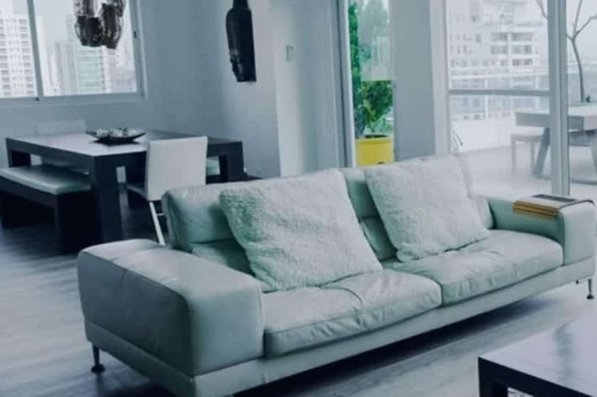 Sleek minimalist kitchen with peninsula, gray cabinets, stainless appliances in PH Premium Tower San Francisco