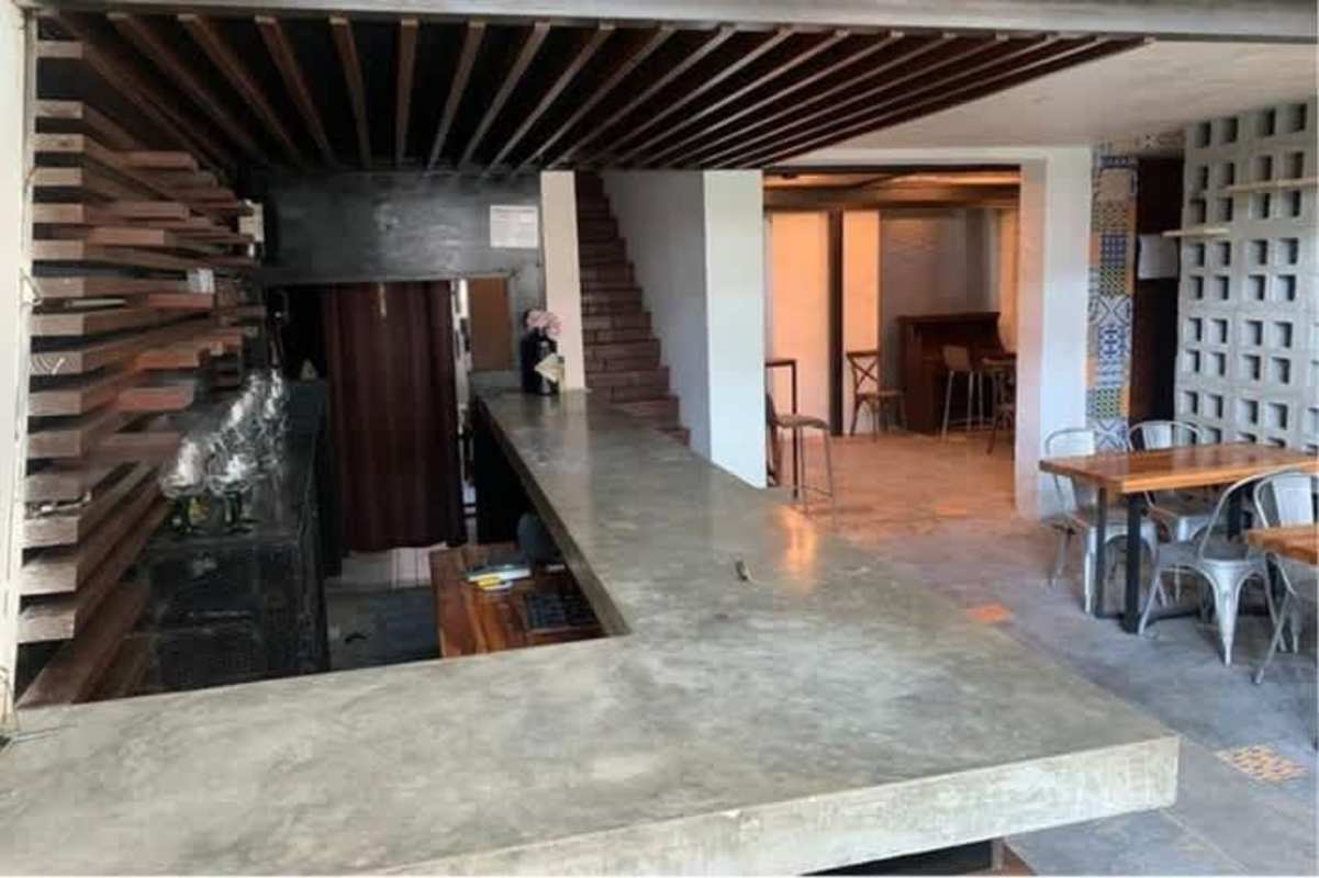 Glass enclosed elevator in historic five-story commercial building Casco Viejo Panama