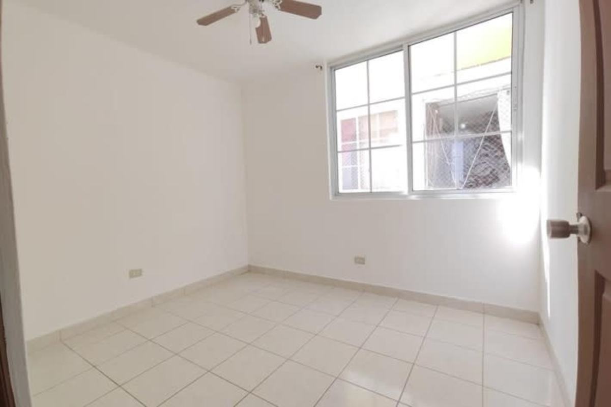 Bedroom with window, ceiling fan, white tile floors PH Mystic Hills near El Crisol Metro Panama City
