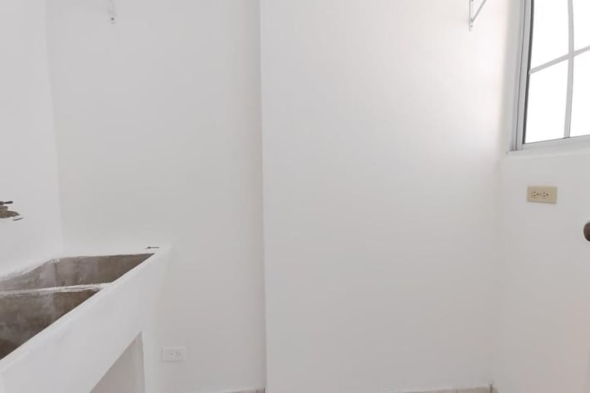 Simple minimalist bathroom with walk-in shower pedestal sink PH Mystic Hills San Miguelito Panama