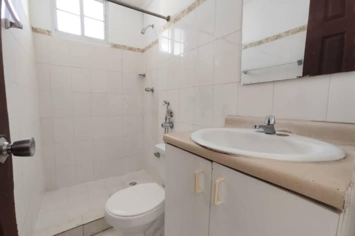 Minimalist bathroom with pedestal sink walk-in shower PH Mystic Hills Panama City
