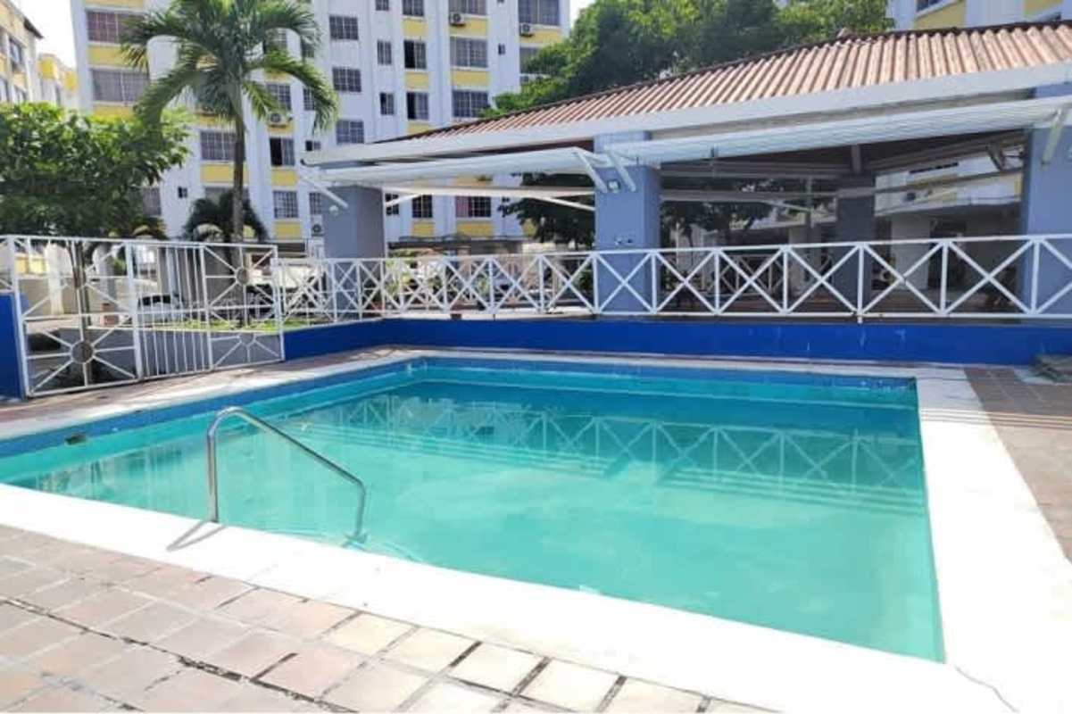 Swimming pool palm trees playground PH Mystic Hills San Miguelito Panama