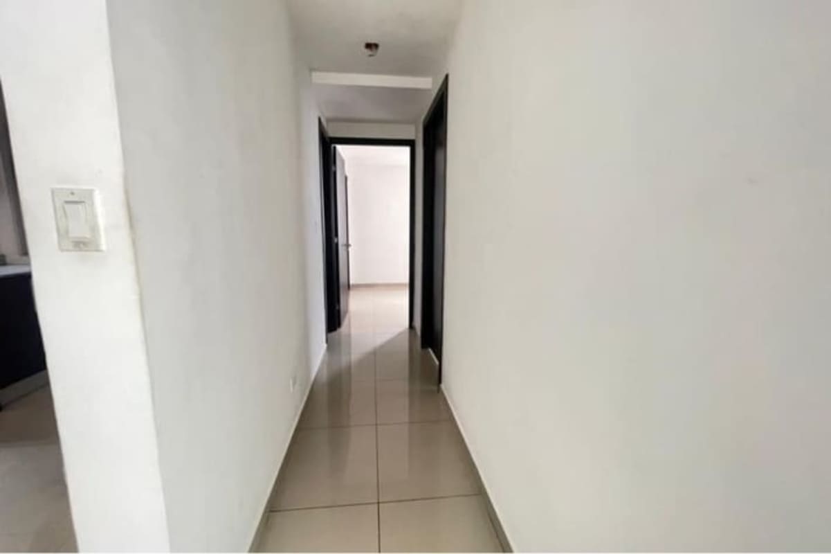 Open kitchen with granite counters and upper storage cabinets in PH Carrasquilla Park San Francisco Panama