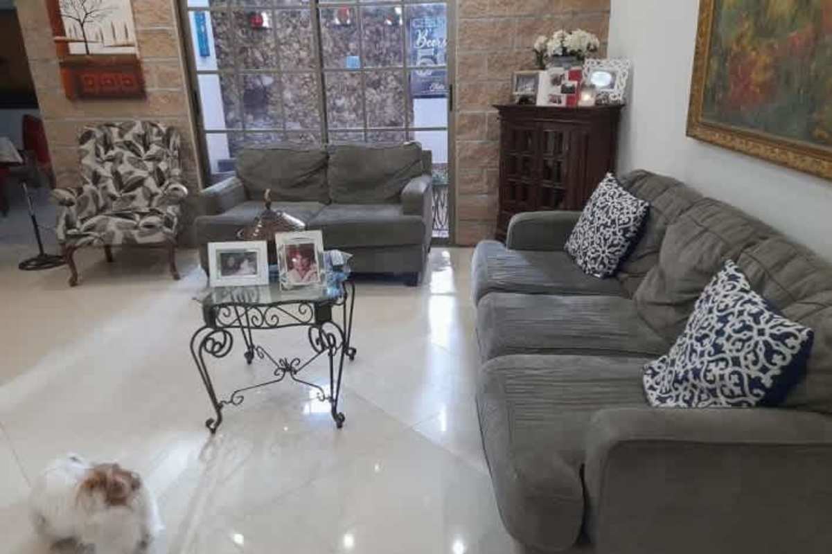 Spacious living area with large windows and modern decor in commercial-residential property San Francisco Panama City