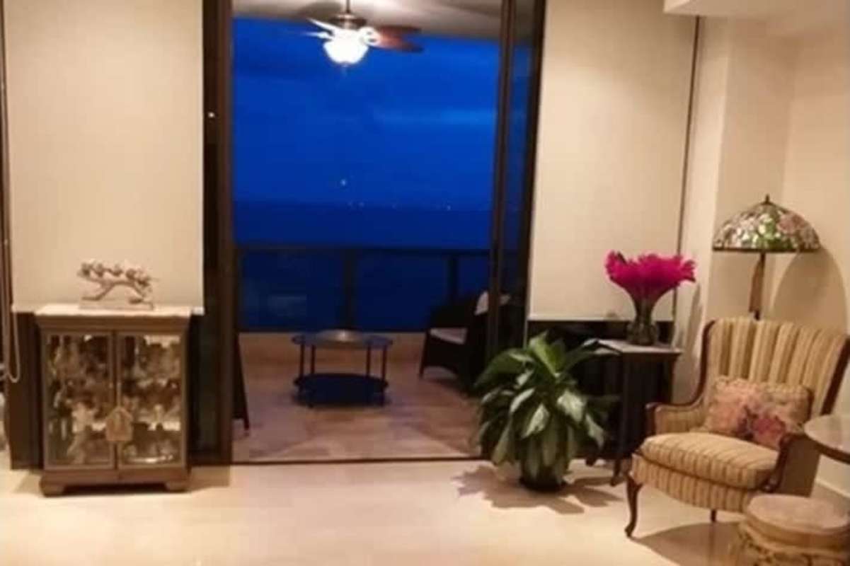 Traditional dining room with chandelier panoramic ocean and city night view in PH Oceania