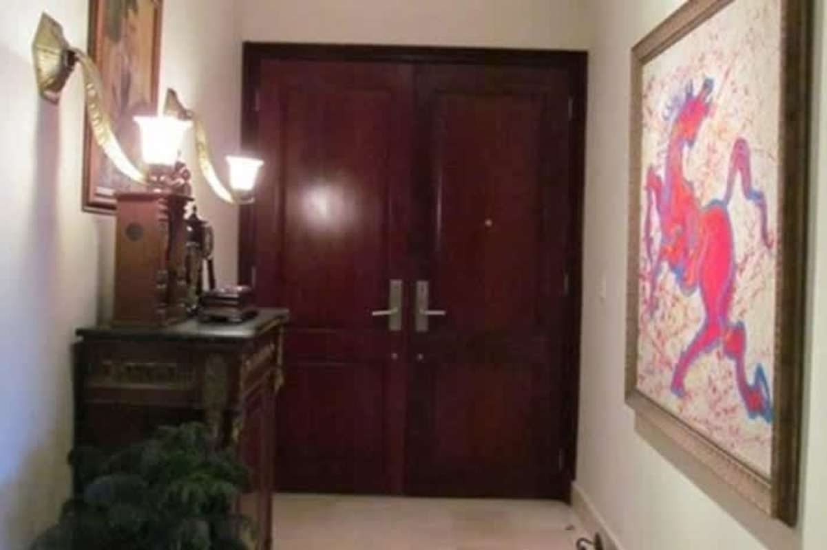 Traditional entrance foyer with double doors at PH Oceania Costa del Este