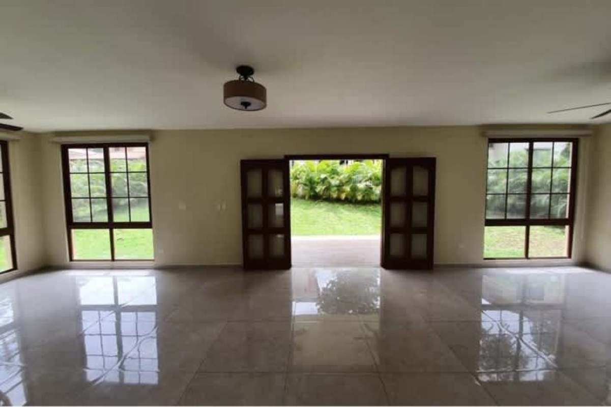 Luxury living space with tile floors large windows overlooking garden in Senderos de Clayton Panama