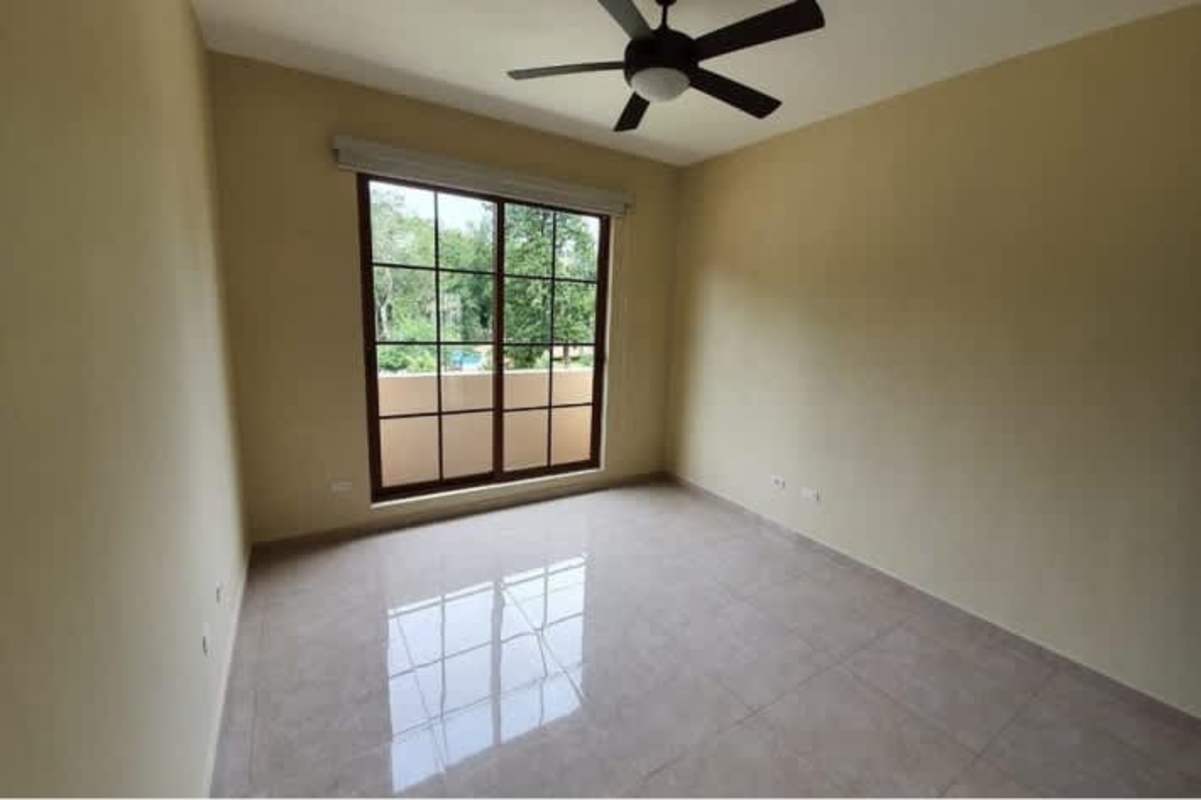 Spacious bedroom with large window tile flooring luxury house Senderos de Clayton Panama
