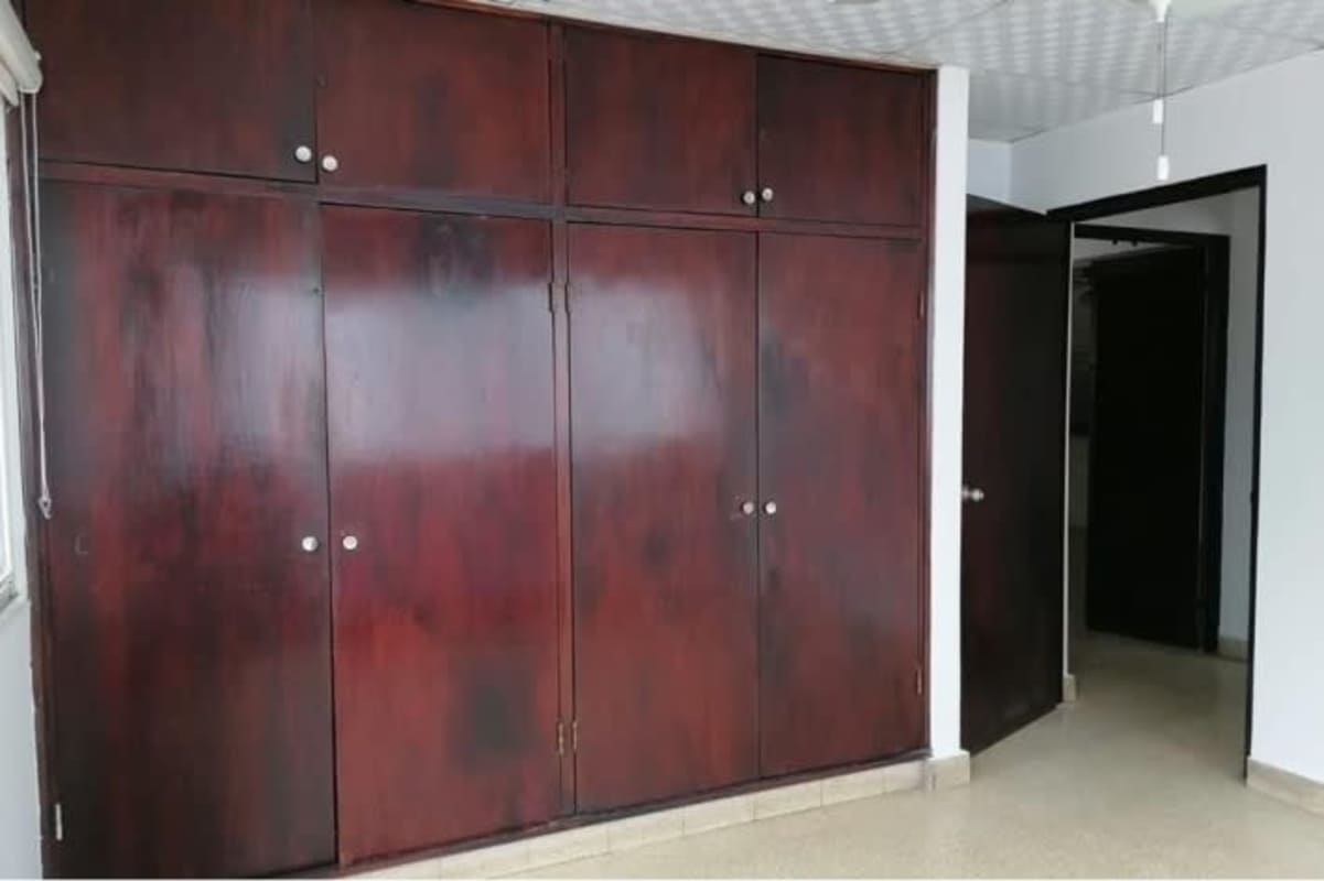Bedroom with large built-in wardrobe tiled floor PH Obarrio Plaza Panama rental