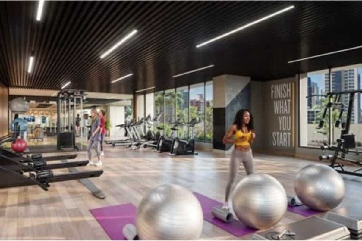 Modern gym in PH LOV El Cangrejo with large windows and fitness equipment