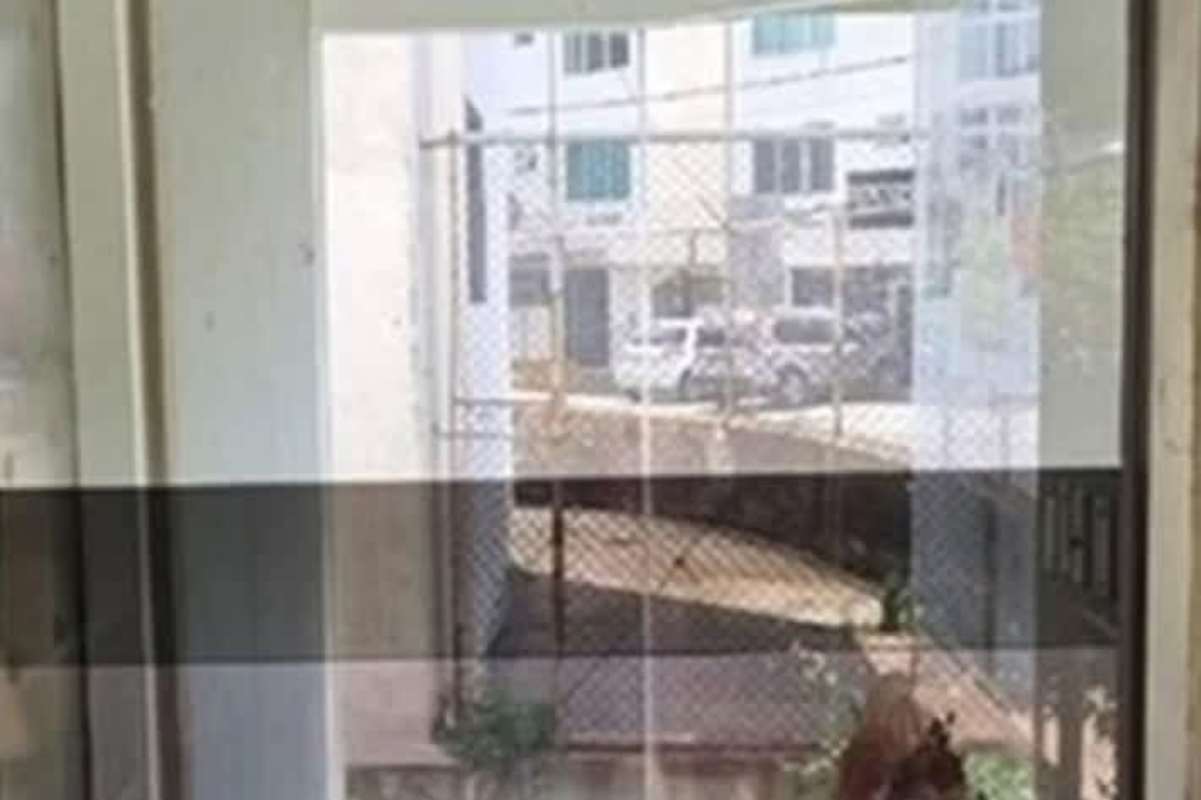 View through large glass window showing street and parking at Obarrio Business Center Panama City