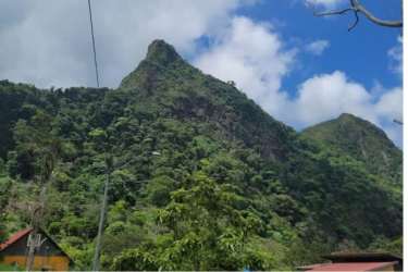 Lakefront surrounded by lush mountainscape in La Laguna San Carlos perfect for nature retreat land.