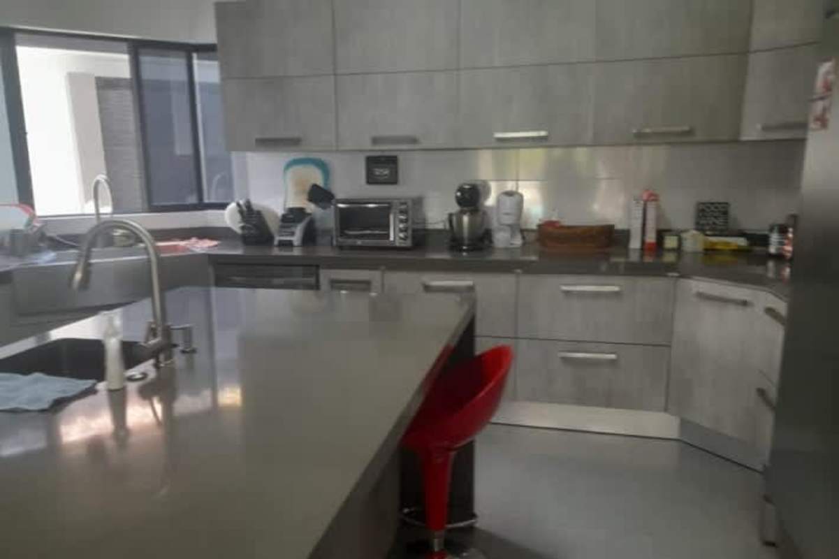 Private backyard with skateboard half-pipe ramp and lush landscaping Costa del Este Panama